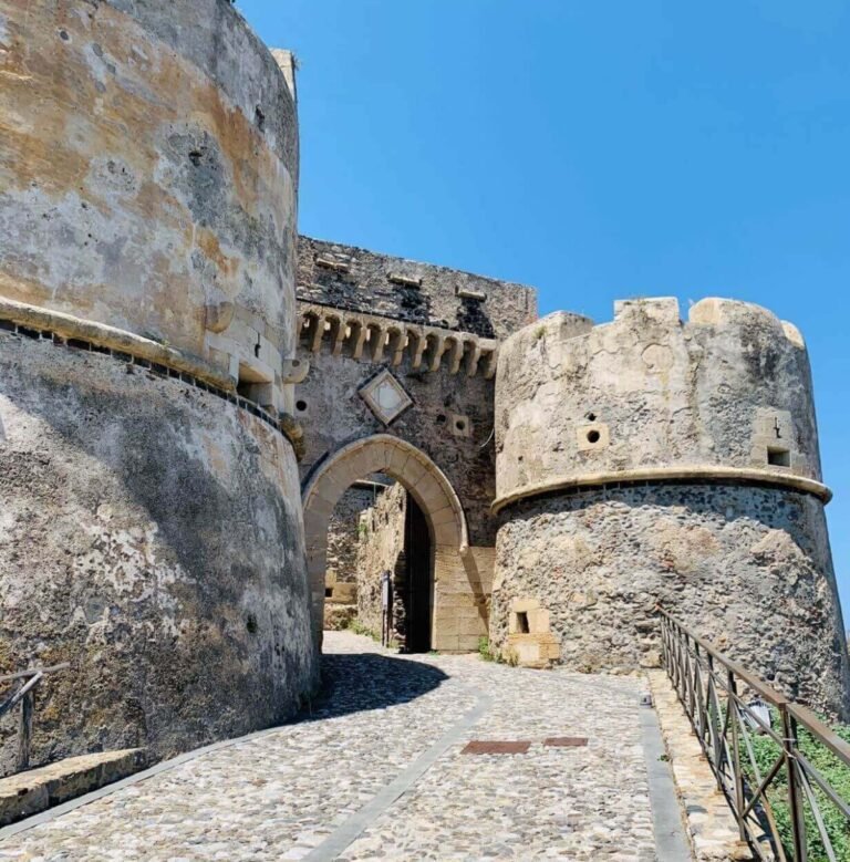The Medieval Castle of Milazzo with fortified walls and round towers