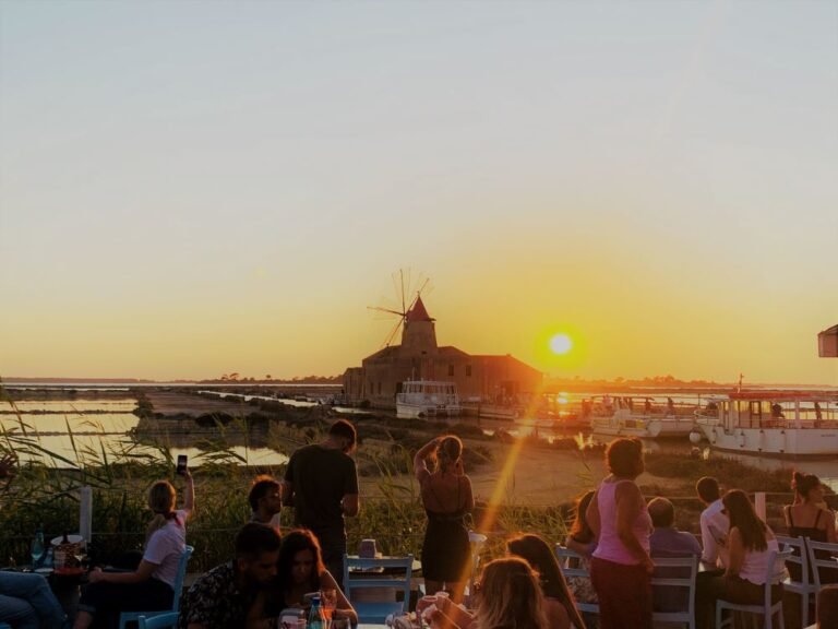 Having an earlier dinner and watching the sunset over the salt lakes of Marsala which overlooks the island of Mozia, Western Sicily